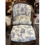 An Empire style blue and white upholstered armchai