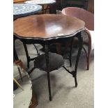 An Edwardian mahogany occasional table with a shap