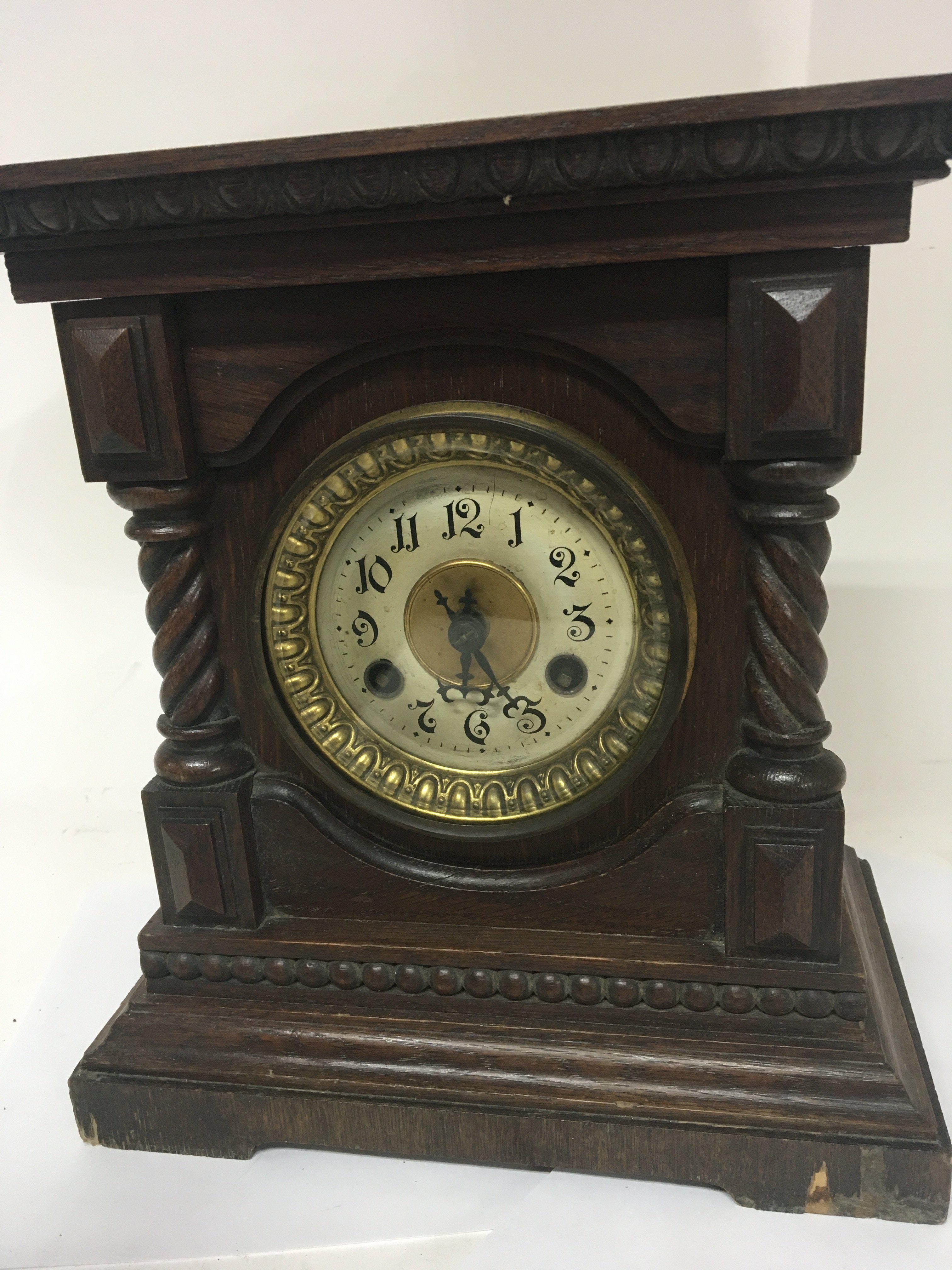 A Continental walnut mantel clock with spiral pila