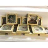 Large collection of boxed collectors plates.