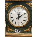 A marble mantle clock the circular dial with Roman