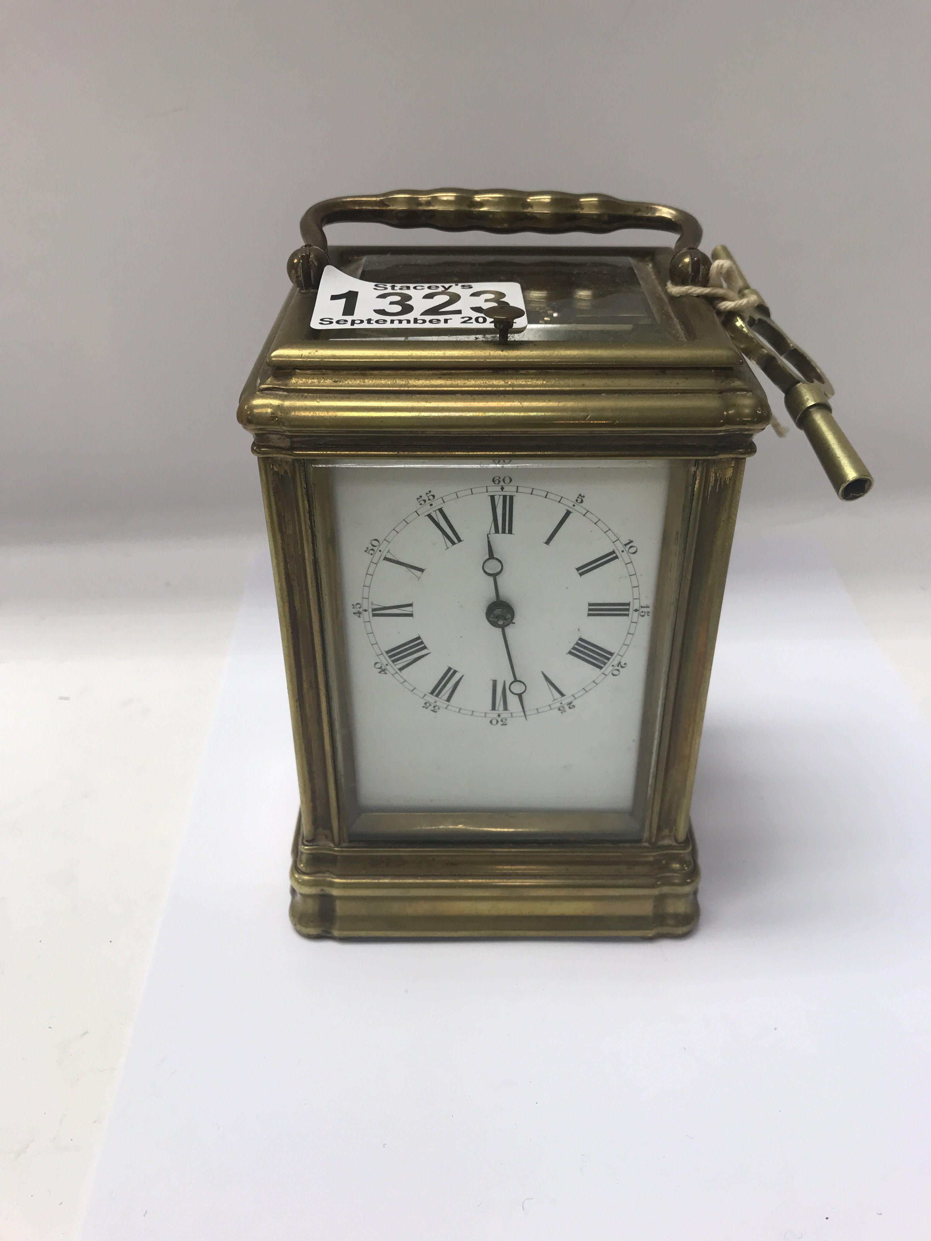 A brass cased carriage clock with repeat movement
