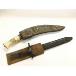 A British bayonet and leather scabbard together wi