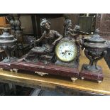 A spelter clock of classical form in the form of m
