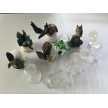 A small ceramic and glass thimble collection inclu