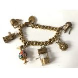 9ct gold charm bracelet. Approx 38.2g.