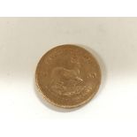 A 1980 1 oz fine gold Krugerrand.