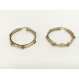 A pair of 9ct gold stone set hoop earrings, approx