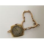 A Vintage 18carat gold ladies watch with an attach