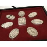 A presentation set case containing silver boxes Th