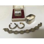 Two silver napkin rings a pair of silver earrings