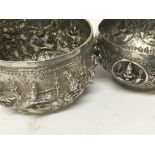 Two Indian white metal bowls with raised deity .