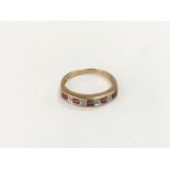 A 9ct gold, square cut ruby and diamond half hoop