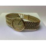 A Ladies mechanical Baume & Mercier 18ct yellow go