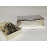 A silver desk top cigarette box of rectangular sha