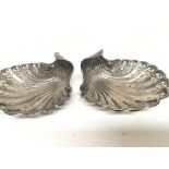 A pair of Silver Shell shaped dishes with pierced