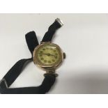 A gold cased wrist watch and a collection of dress