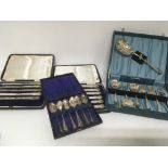 A collection of cased silver and silver plated cut
