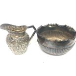 A Victorian silver jug with folate decoration and