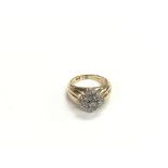 An unusual 9ct gold wide shouldered diamond set cl