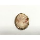 A gold framed cameo brooch, approx 4cm and approx