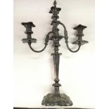 A silver plated three branch candleabra with snuff