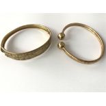 9ct Tourke bangle and a 9ct bangle engraved. Appro