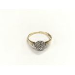 A 9ct gold three tier diamond cluster ring, approx