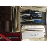 A collection of pens various including Parker and