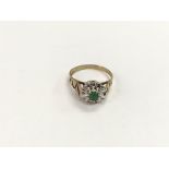 A 9ct gold, emerald and diamond cluster ring, appr