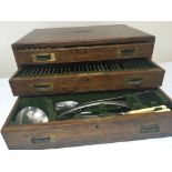 A Quality oak three drawer canteen of silver plate