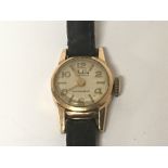 A ladies 18carat gold cased watch with a leather s