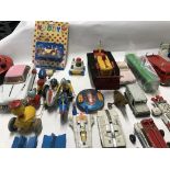 Mixed collection of tin , plastic and die cast vehicles by various manufacturers including dinky..