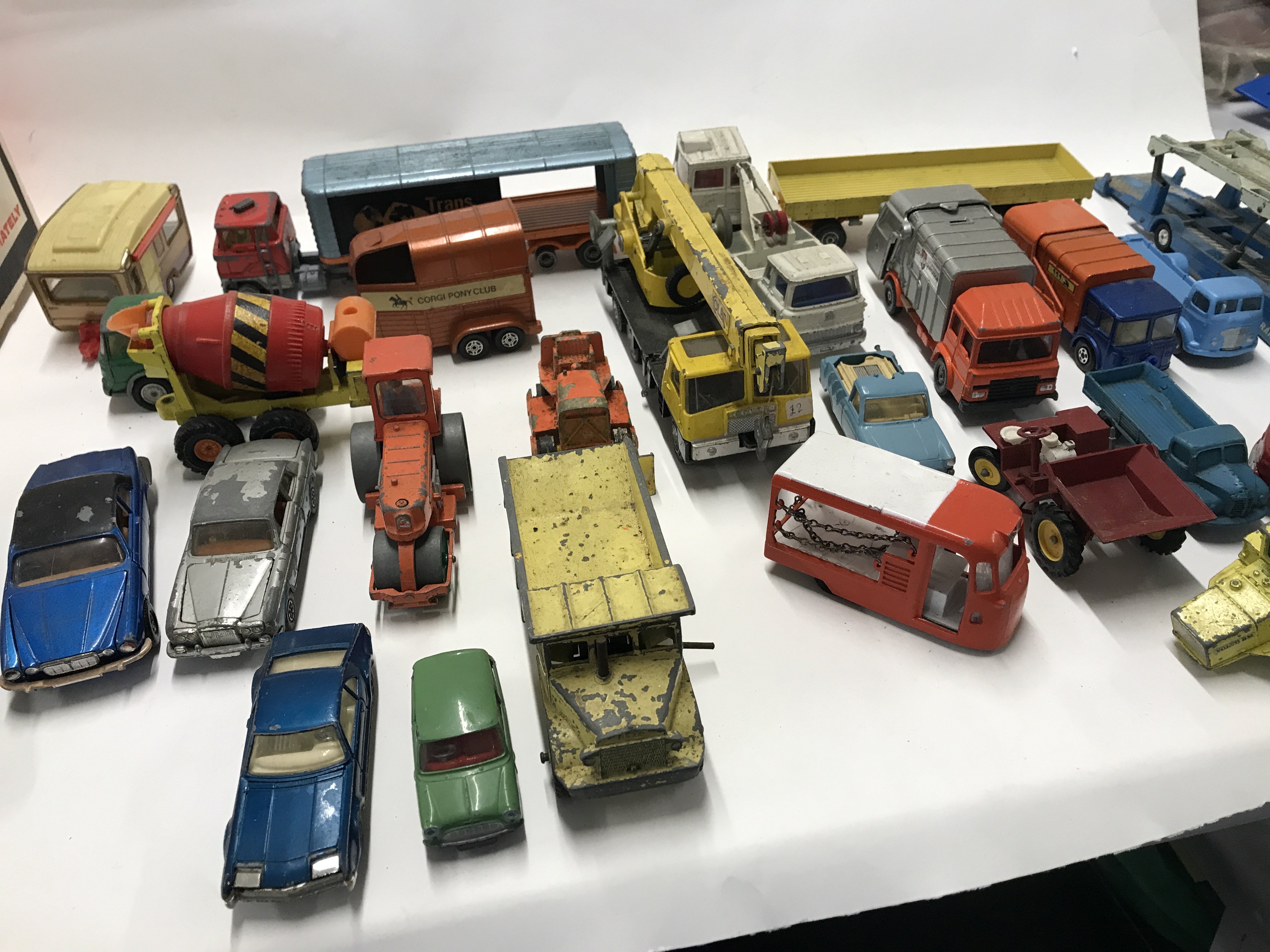 Collection of 25 plus playworn model vehicles by several manufacturers including Corgi Triang and