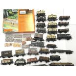 A Box Containing a Collection of 00 Gauge Rolling Stock. And accessories.