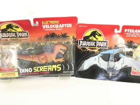 A Boxed Jurassic Park Velociraptor and a Pteranodo