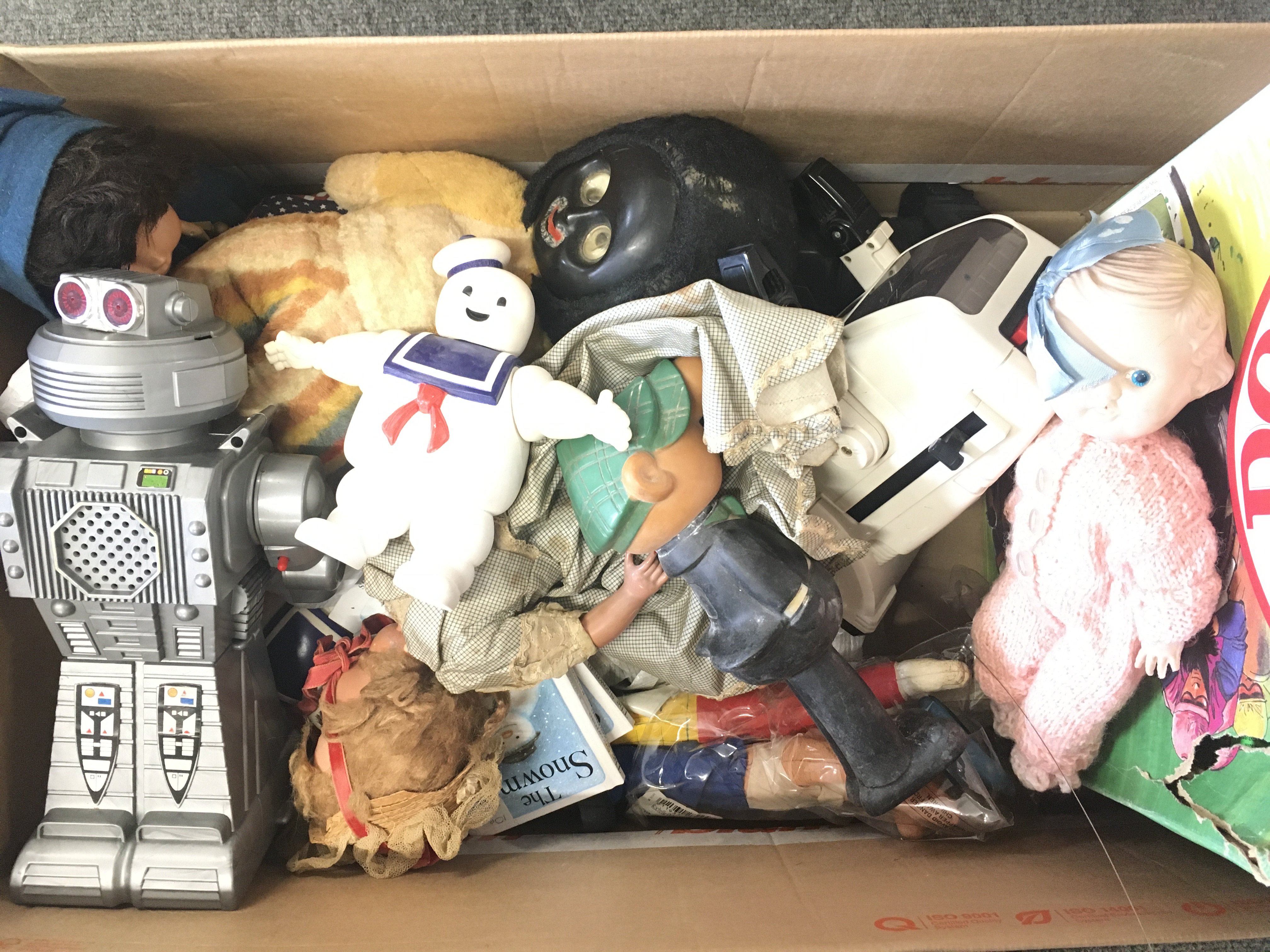 A Box Containing various Playworn toys Including Robots. Dolls. a Golly. Etc.