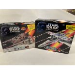 A Boxed Star Wars Snow Speeder and a X- Wing.