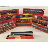 A Box Containing A Collection of Hornby 00 Gauge Coaches and Rolling Stock. All boxed.