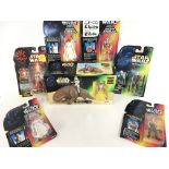 A Collection of Carded Star Wars Figures and a Box