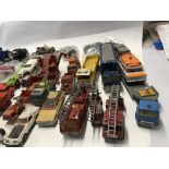 Collection of playworn model vehicles by various manufacturers including Corgi and Matchbox