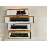 A Boxed Arnold N Gauge 0-6-0 Tank and 3 Coaches.