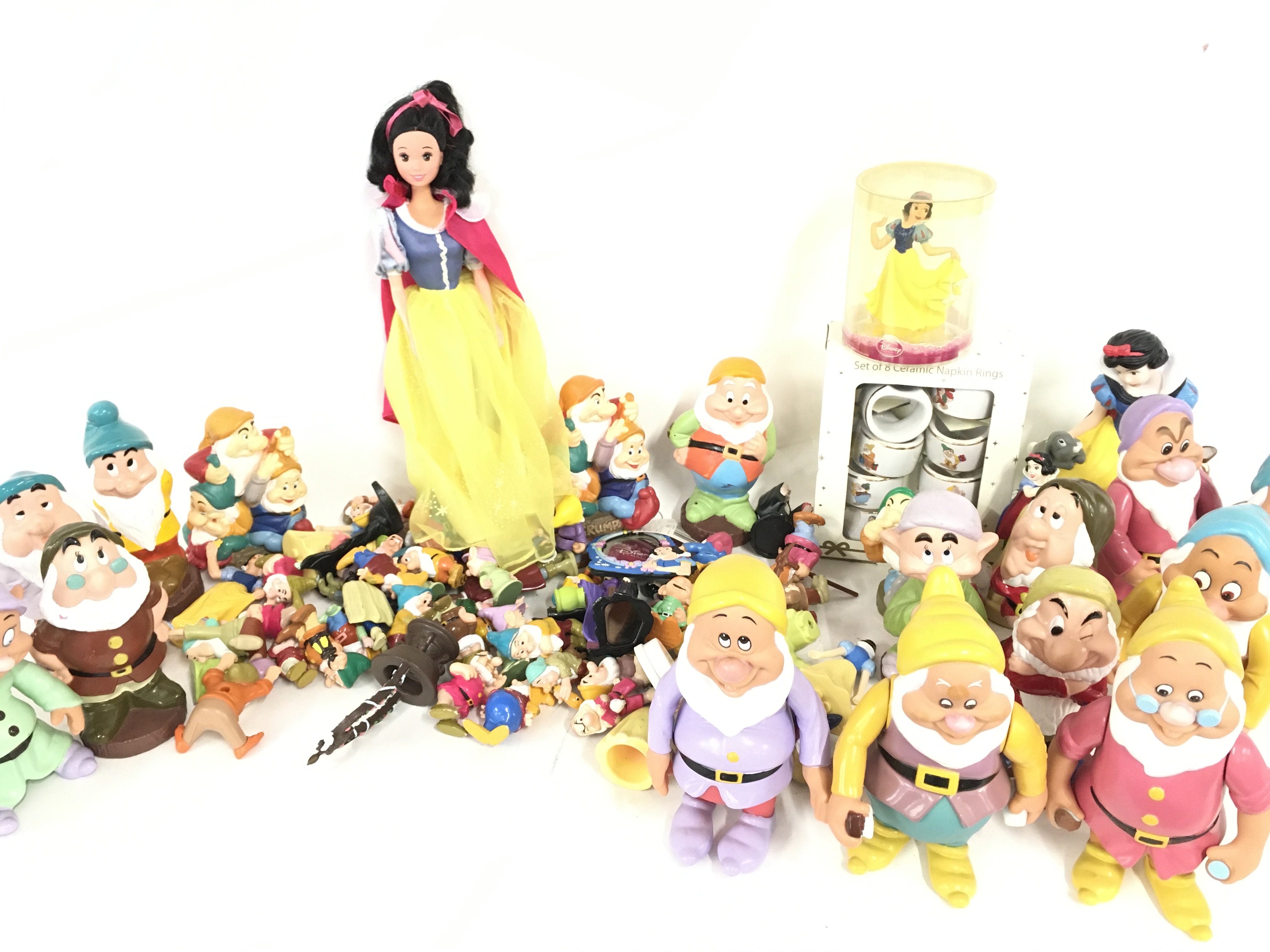 A Collection of plastic Snow White Figures and ite