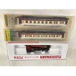 A Boxed Fleischmann N Gauge 0-10-0 tank #7094 With 2 Minitrix Coaches.