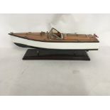 A wooden model boat Riviera English speedboat on w