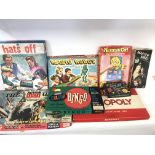 Collection of various board games including magic robot and the action man game.