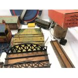 Collection of O gauge railway track and accessories including tin buildings plus 2 transformers.