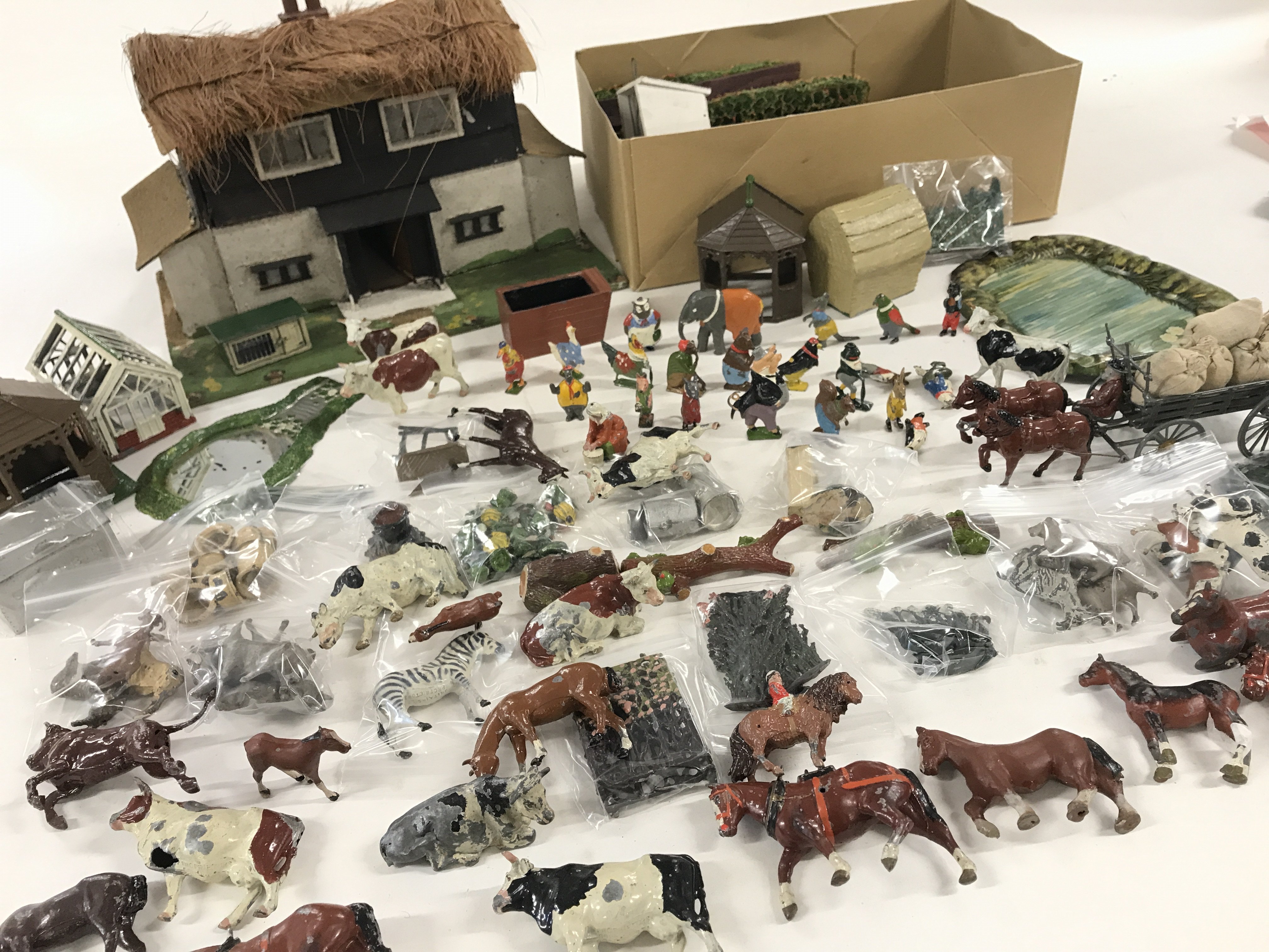 A Collection of Lead Farm Animals and accessories. With a Scratch built House.