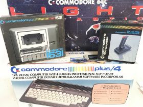 A Boxed Commodore Plus/4. a Commodore 64C light Fa