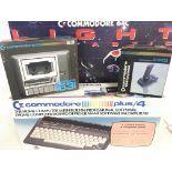 A Boxed Commodore Plus/4. a Commodore 64C light Fa